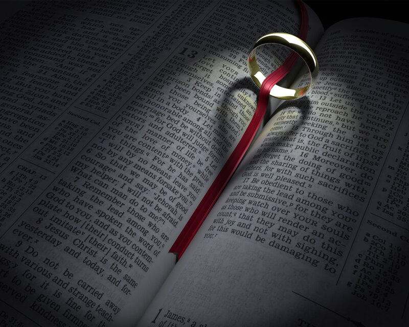 wedding ring on open bible