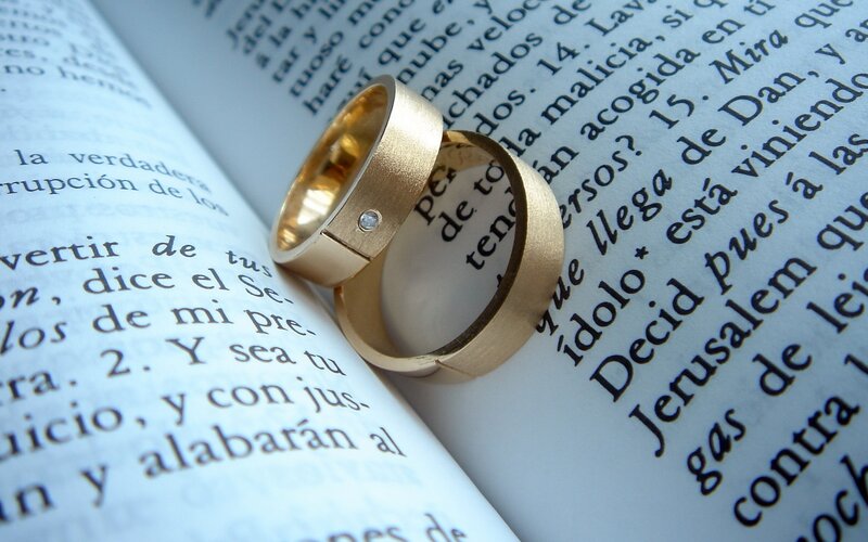 wedding rings on a book