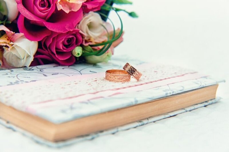 Wedding Rings on Book — Pink