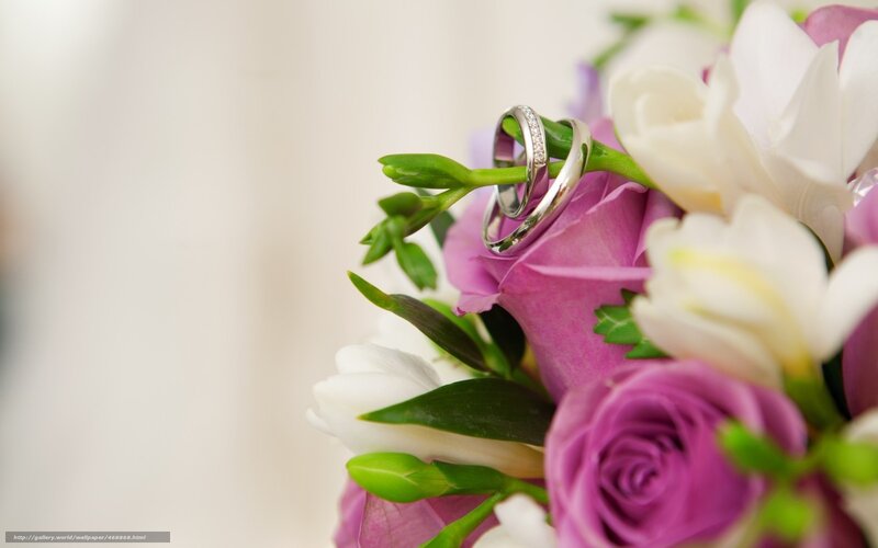 wedding rings on floral bouquet