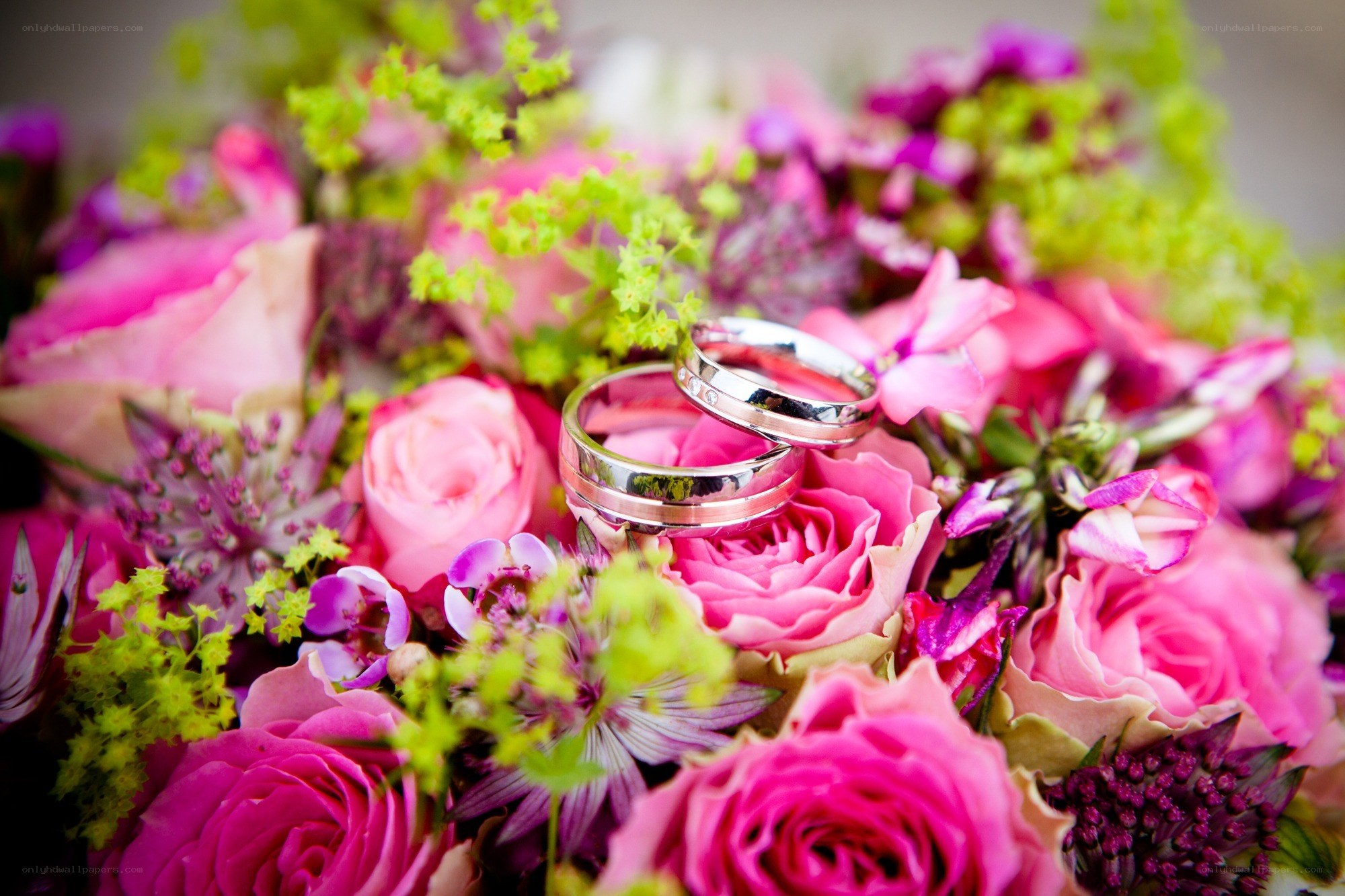 Wedding rings on floral bouquet