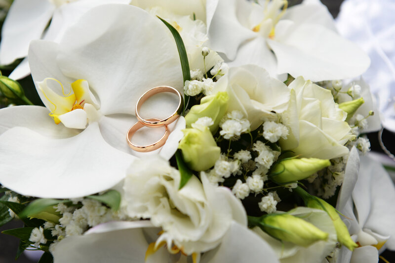 Wedding Rings on Flowers — White, Serene