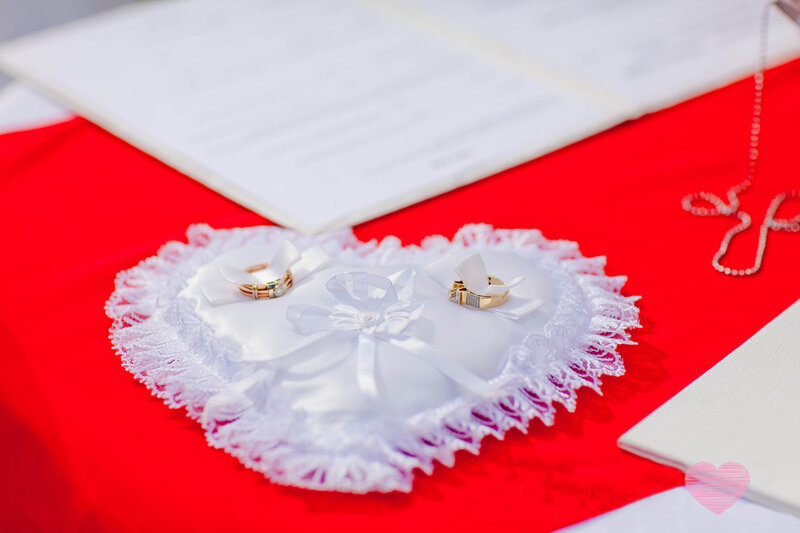 Wedding Rings on Heart Pillow