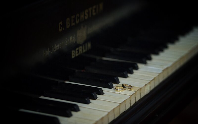 Wedding rings on piano keys
