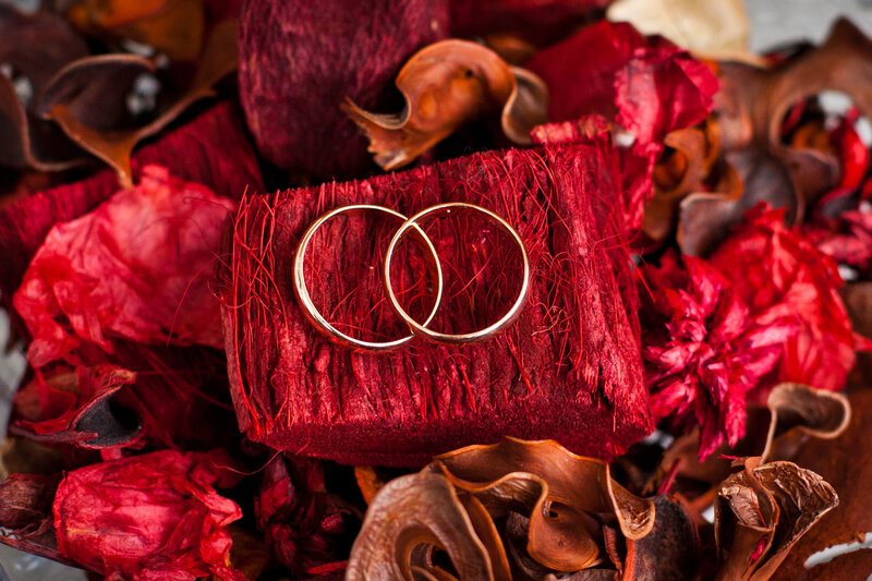 Wedding Rings on Red Fabric