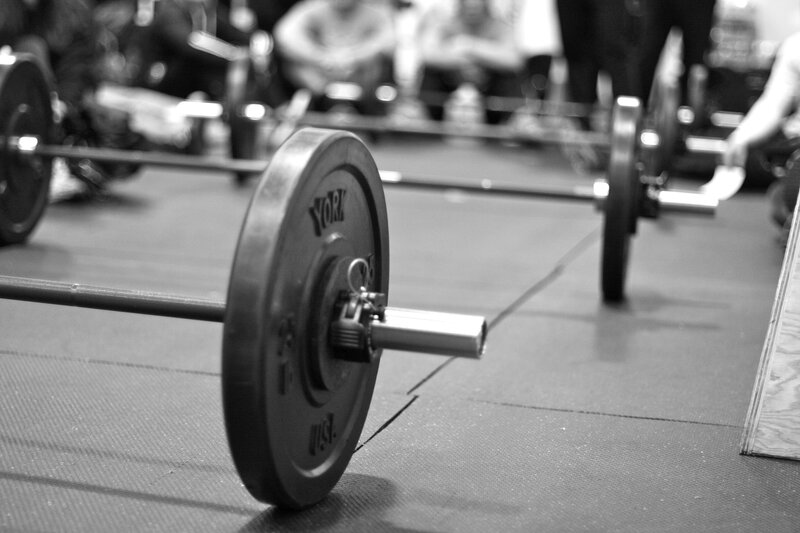 Weightlifting barbells in gym