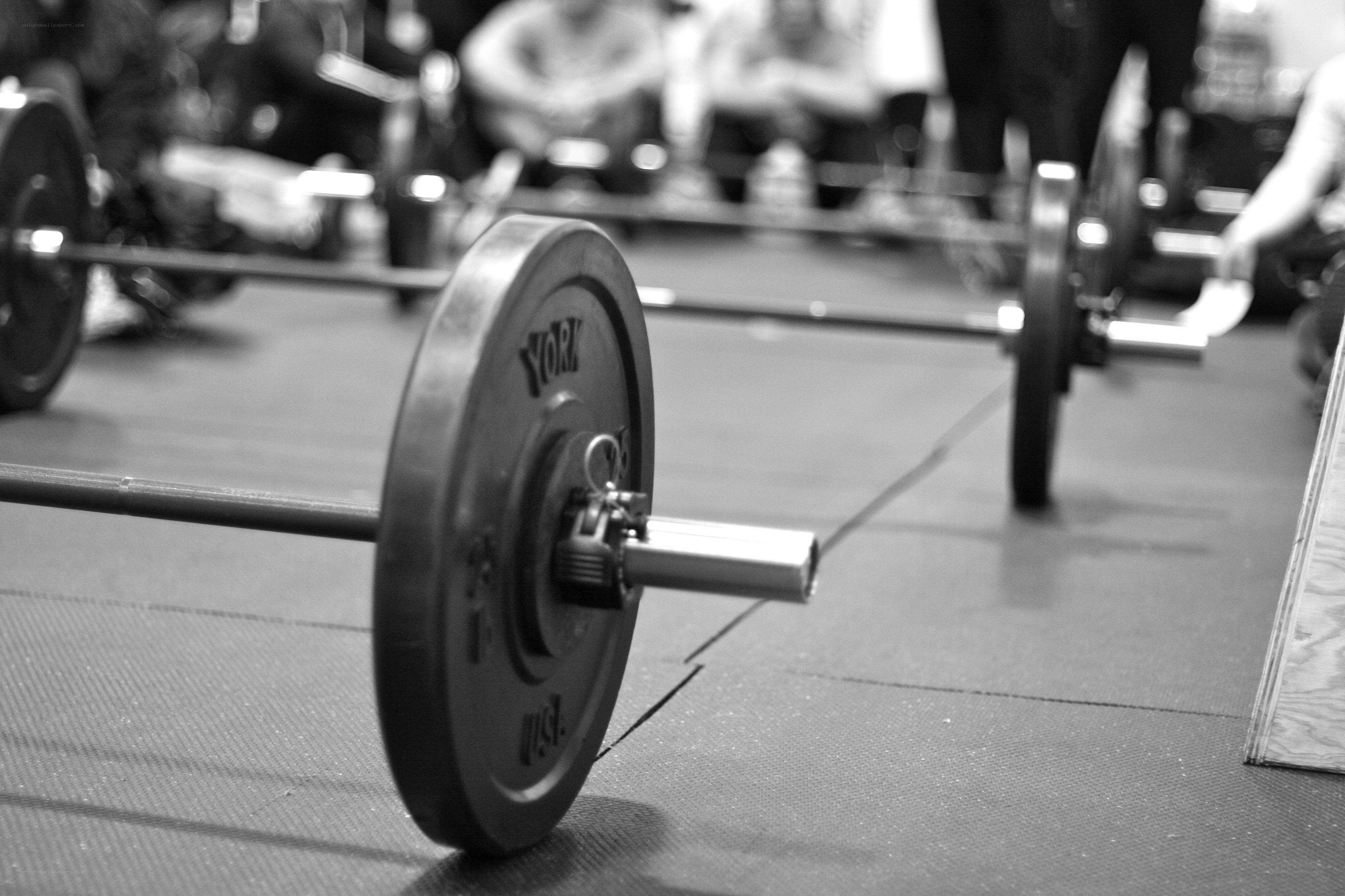 Weightlifting barbells in gym