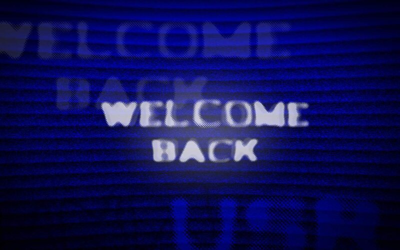 Welcome back text on blue screen