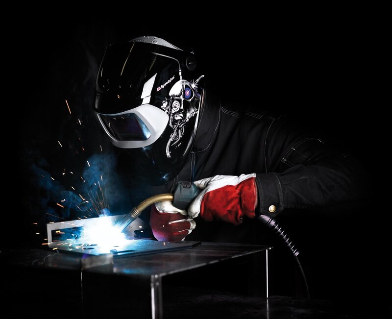 Welder working in dark