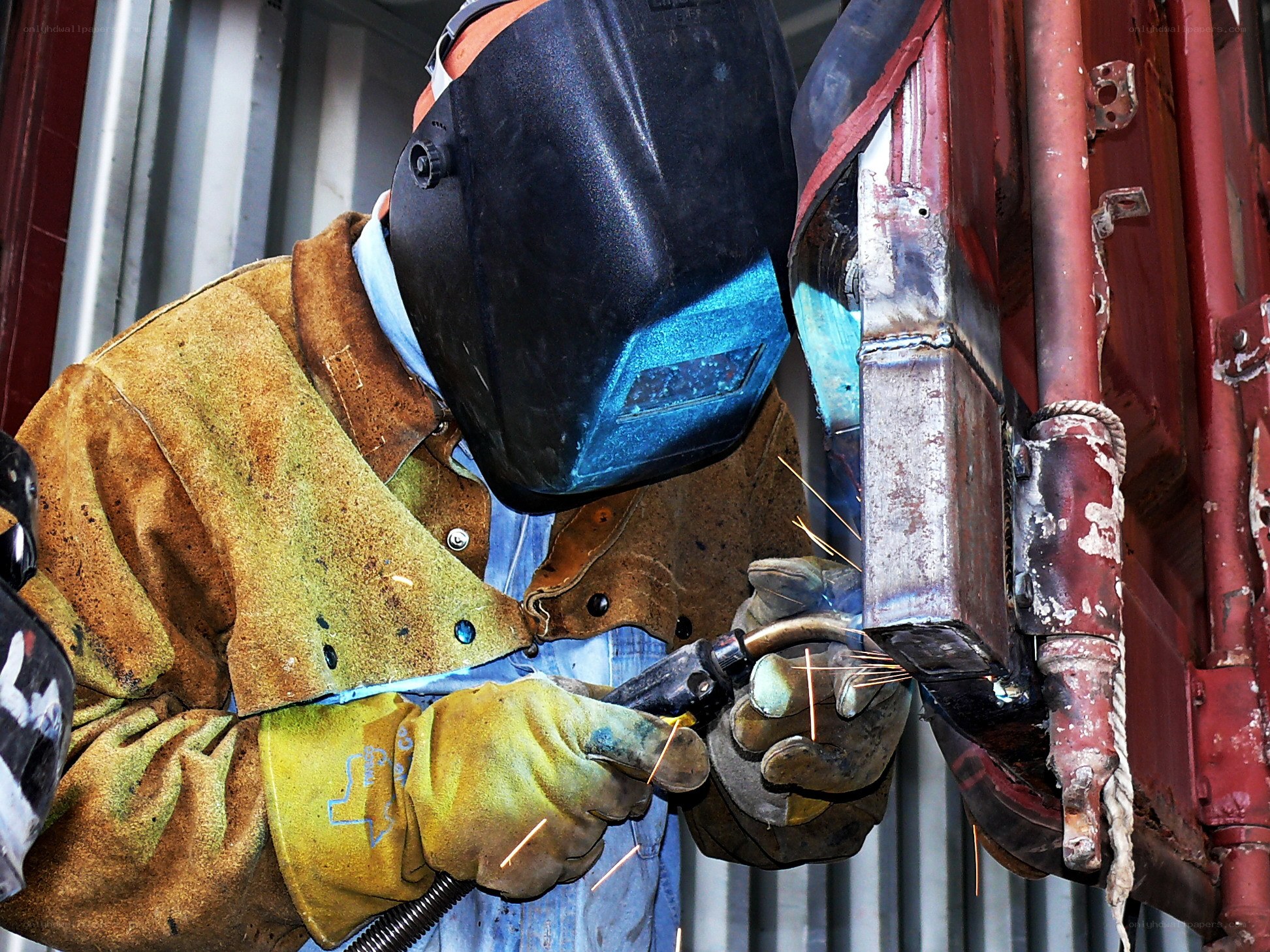 Welder working on metal structure