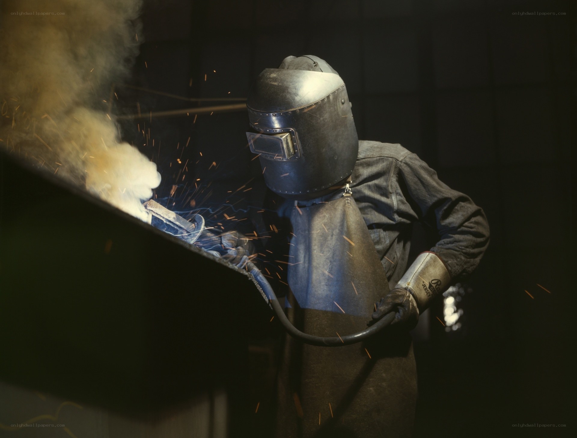 Welder working with sparks