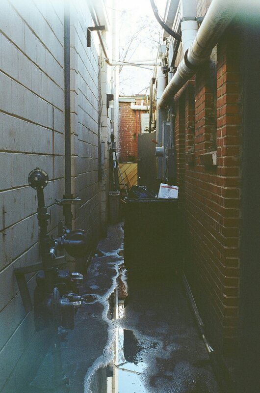 Wet Alleyway Between Buildings