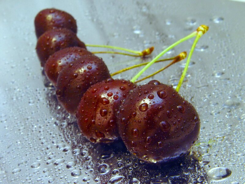 Wet Cherries on Surface