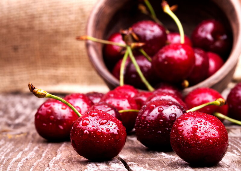 Wet Cherries on Wood