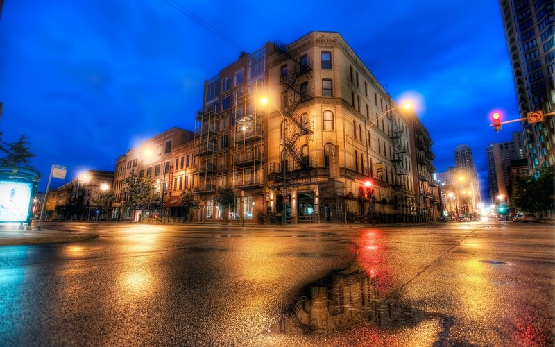 Wet city street at dusk