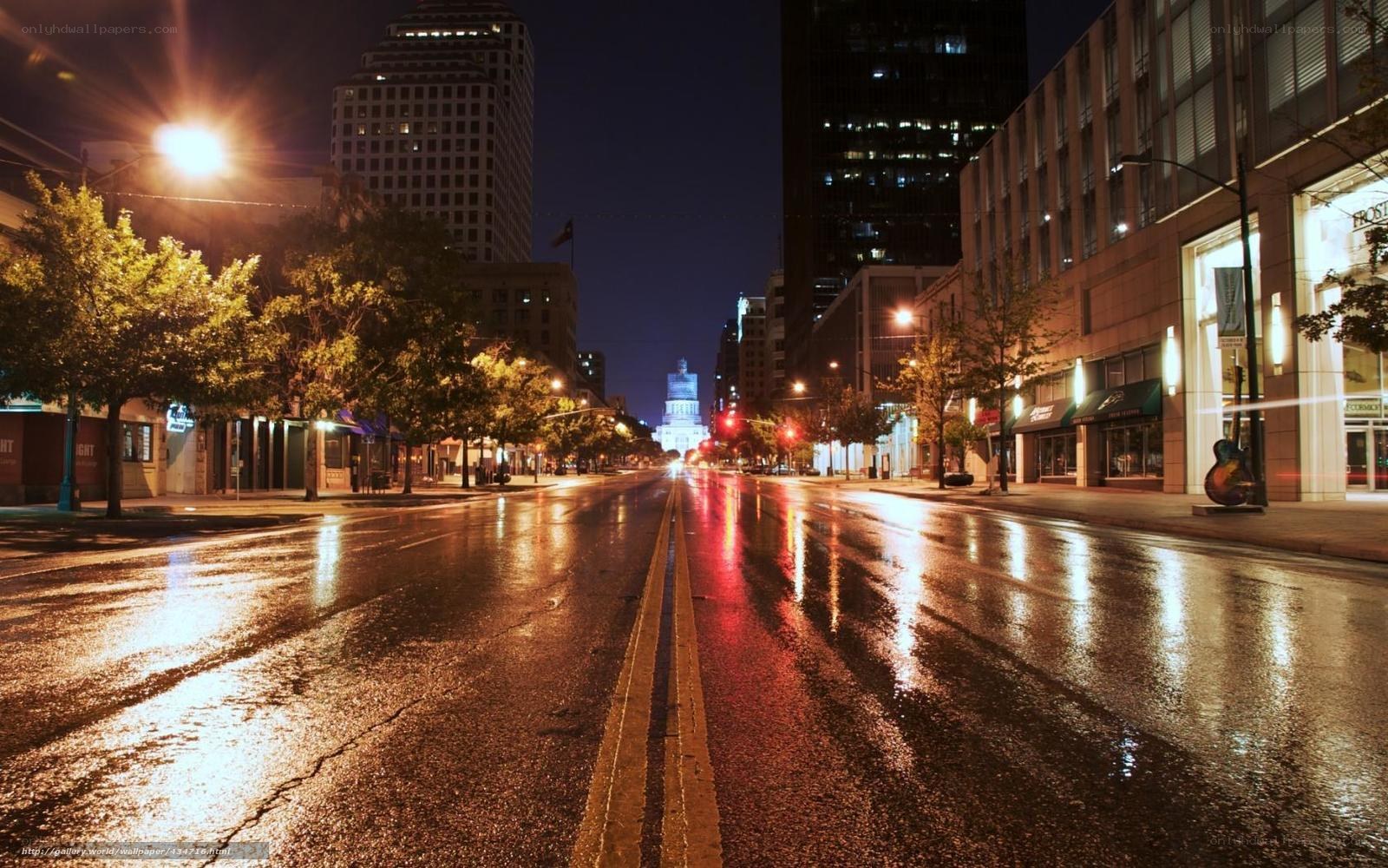Wet city street at night