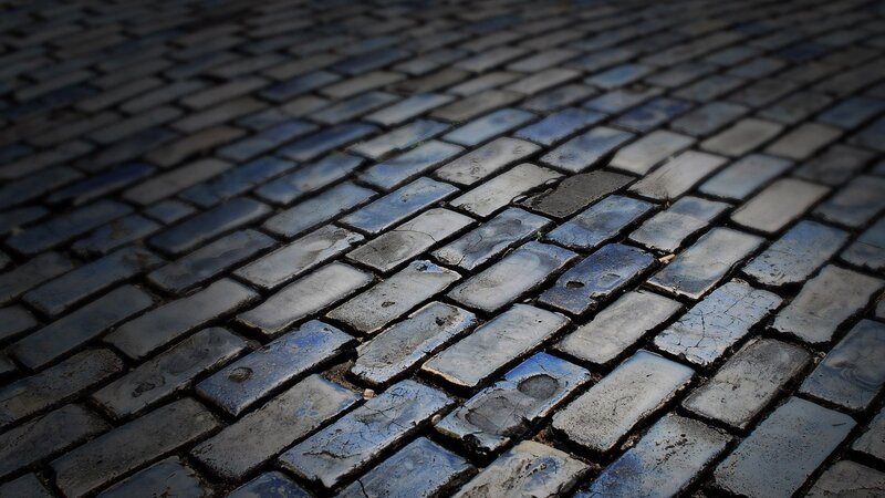 wet cobblestone pavement