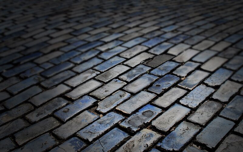 wet cobblestone pavement