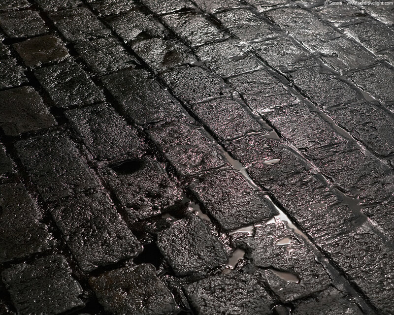 Wet Cobblestone Pavement — Black, Dramatic