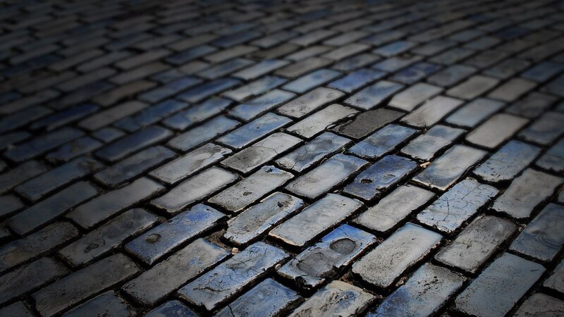 Wet Cobblestone Pavement — Gray, Dramatic