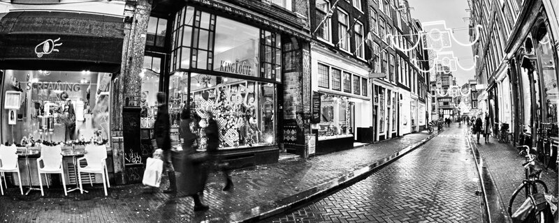 wet cobblestone street in amsterdam