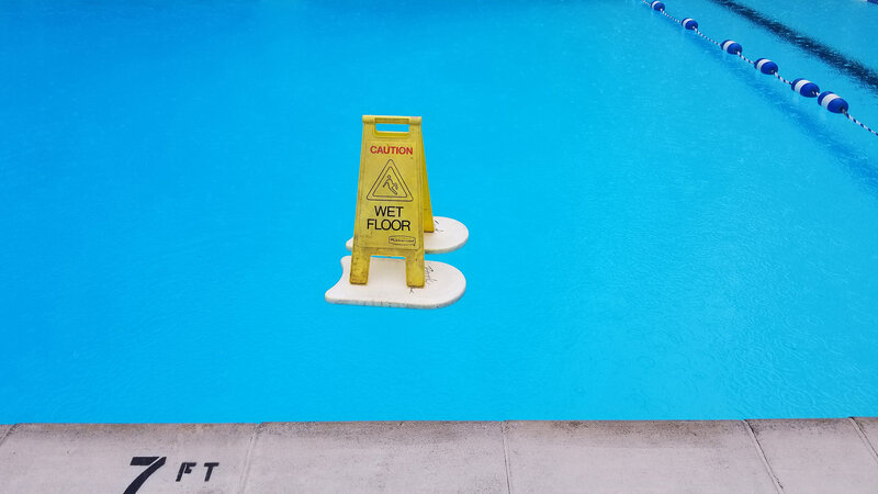 Wet Floor Sign in Pool