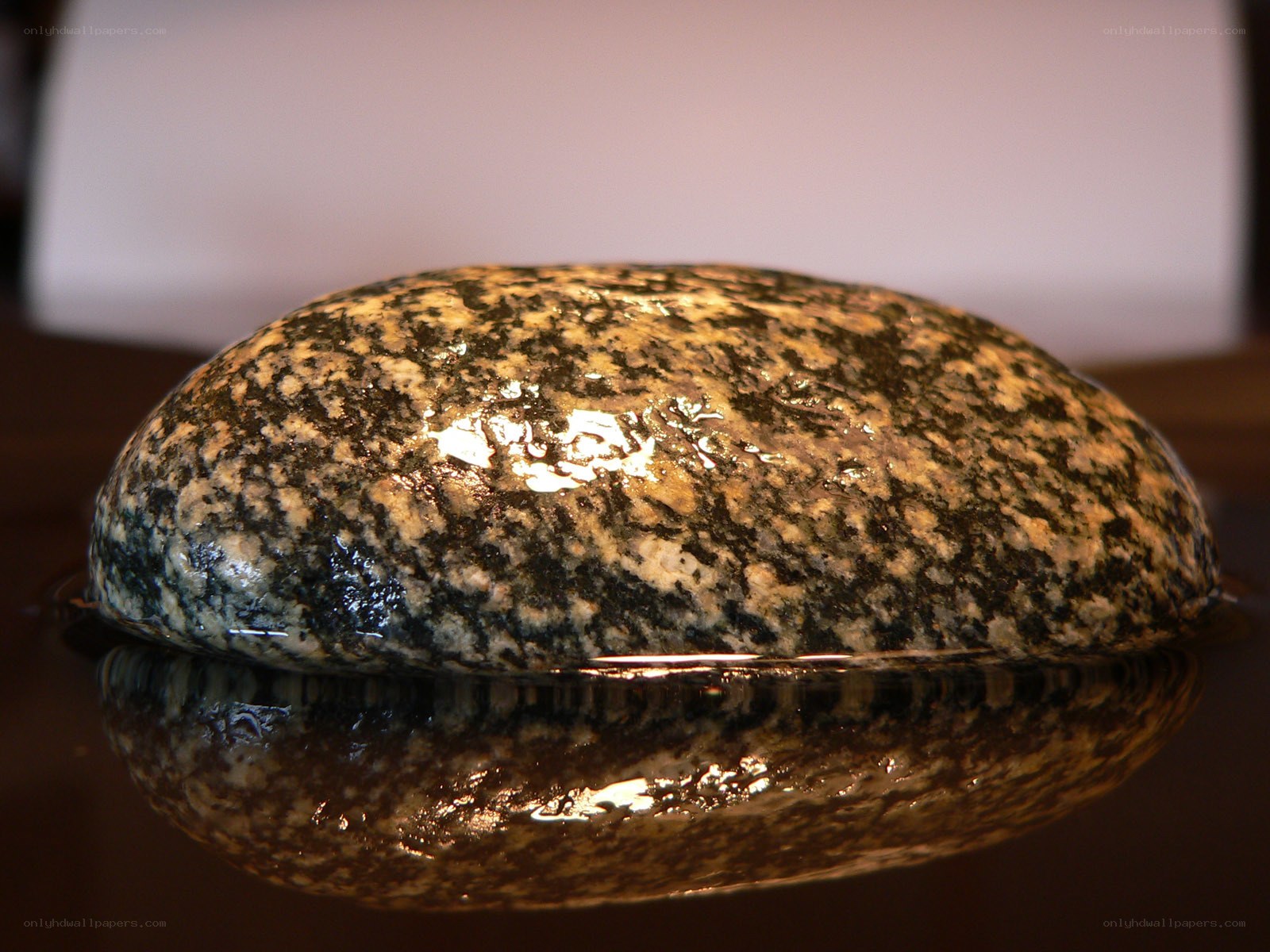 wet granite rock in water