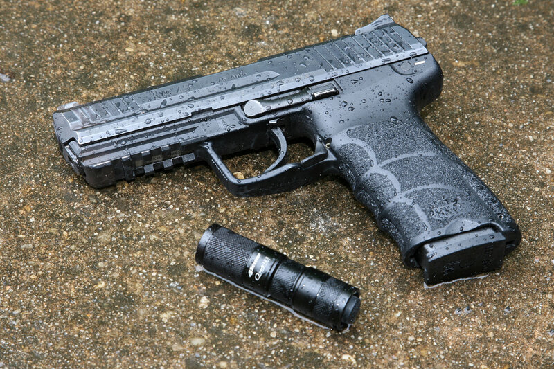 wet handgun and flashlight
