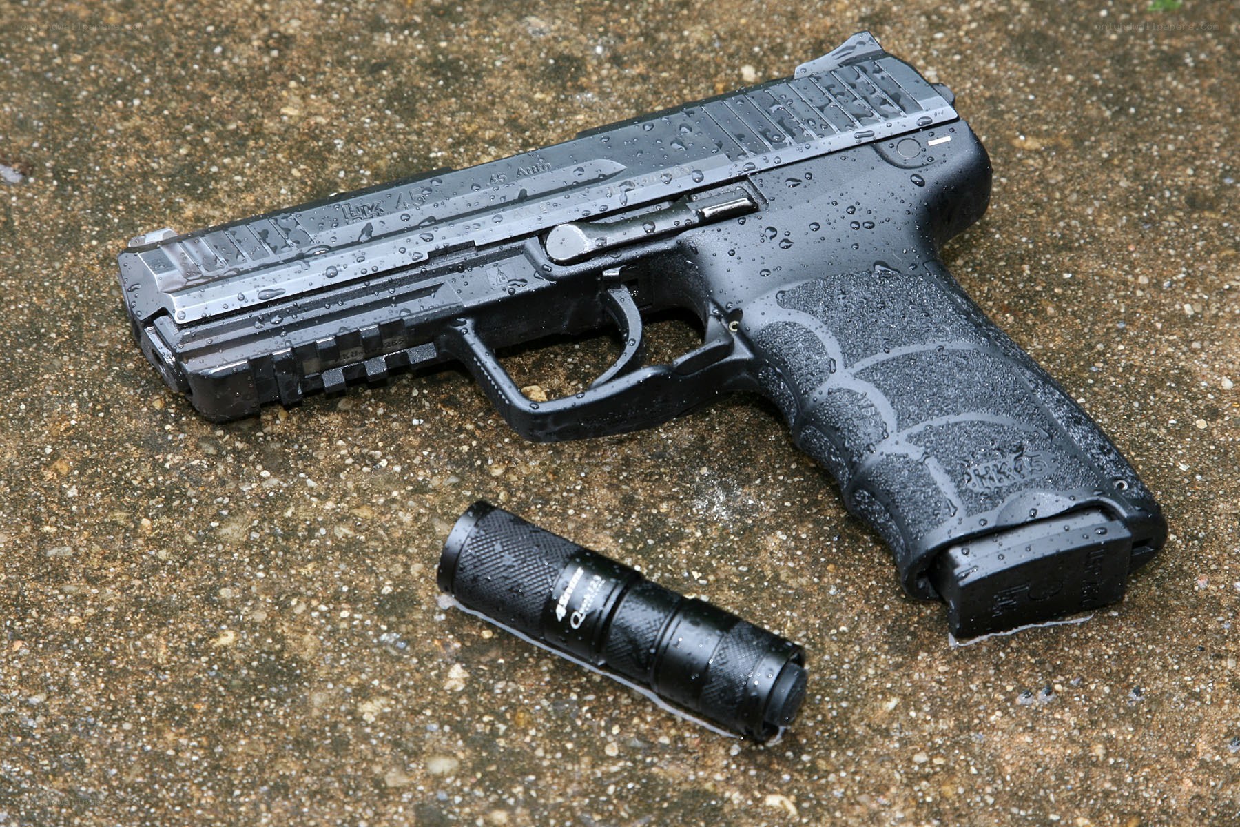 wet handgun and flashlight