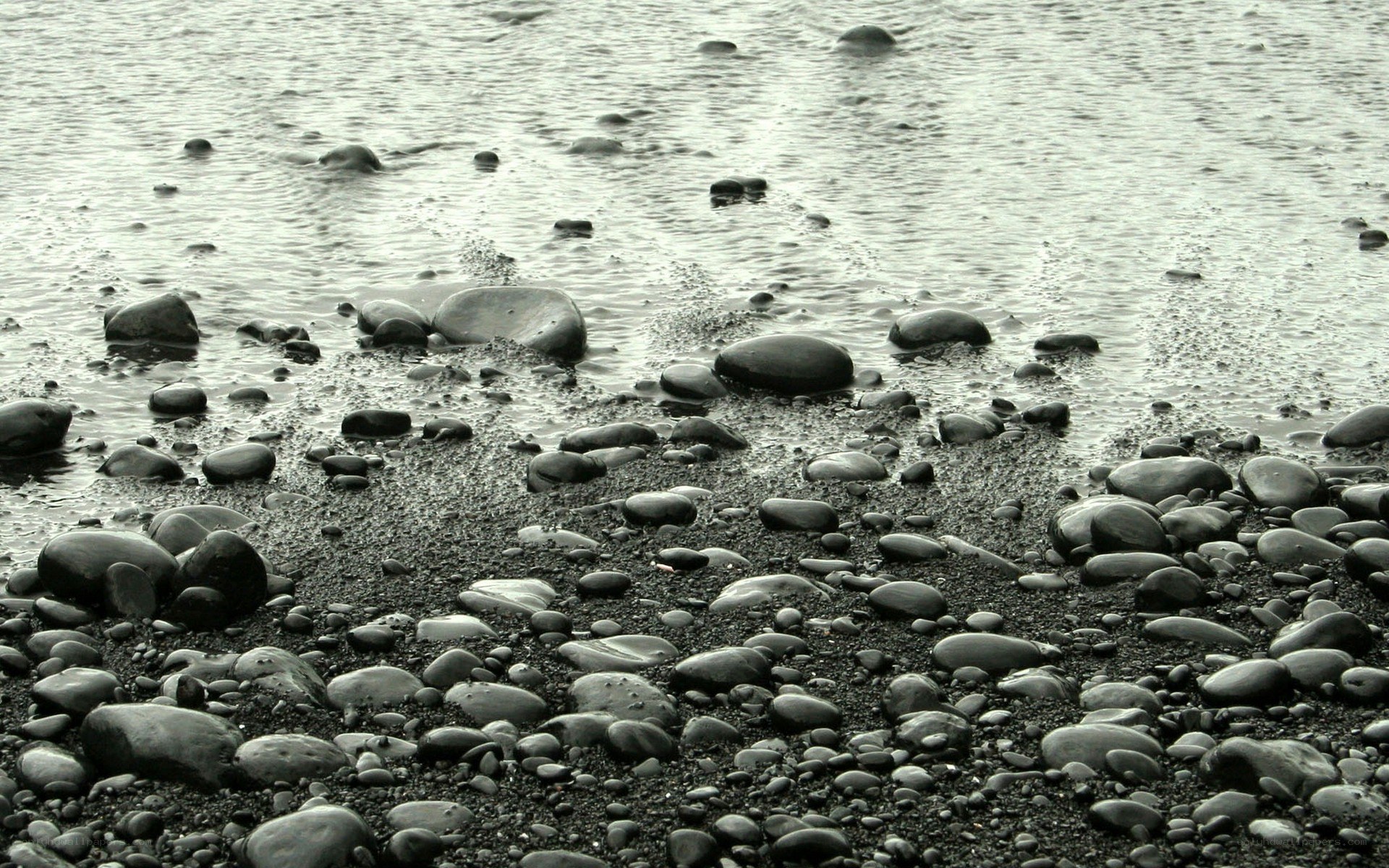 Wet pebbles on a beach