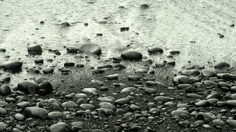 Wet pebbles on a beach