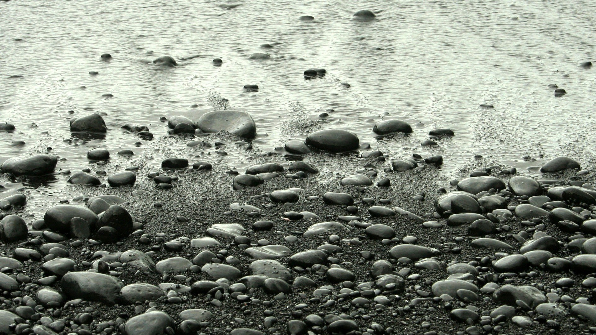 Wet pebbles on a beach