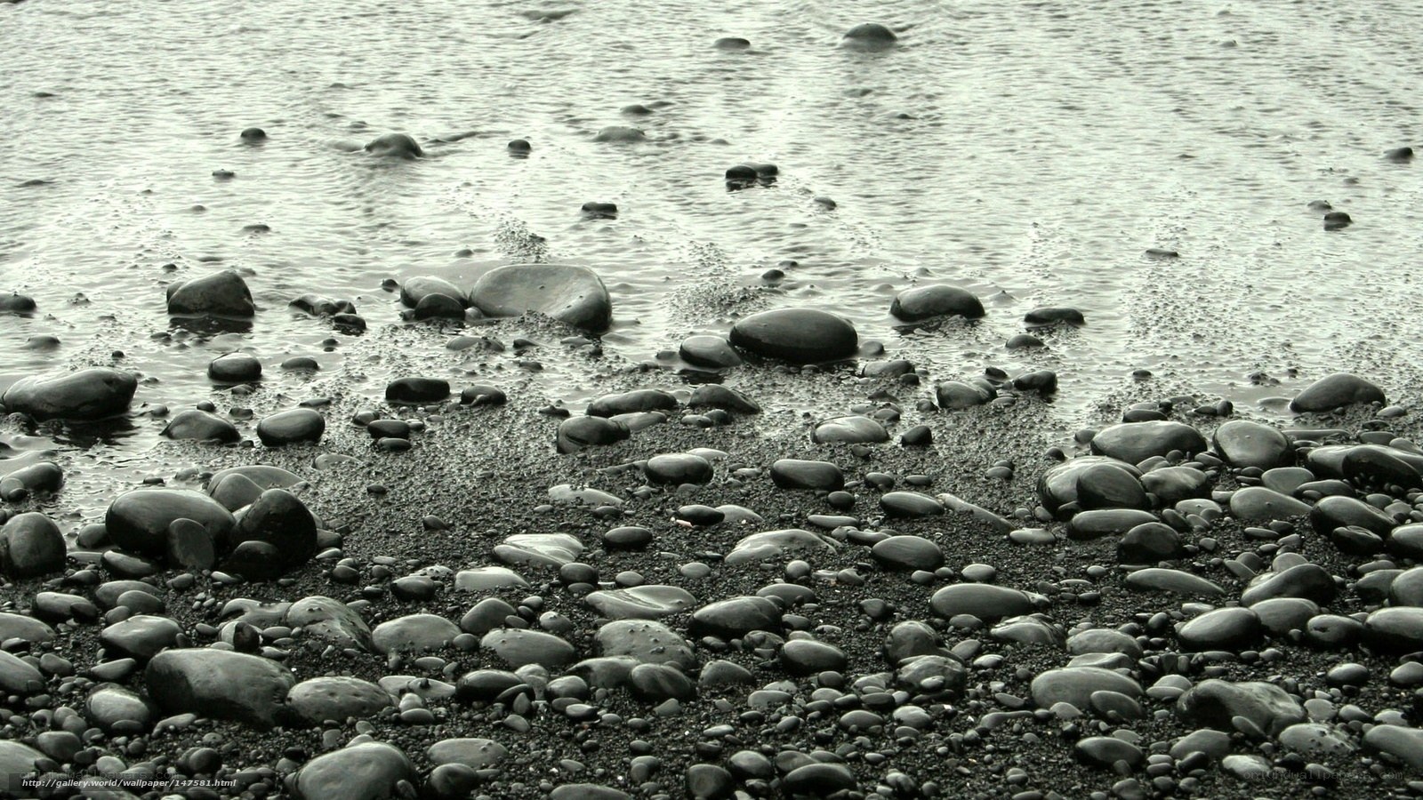 Wet pebbles on a beach