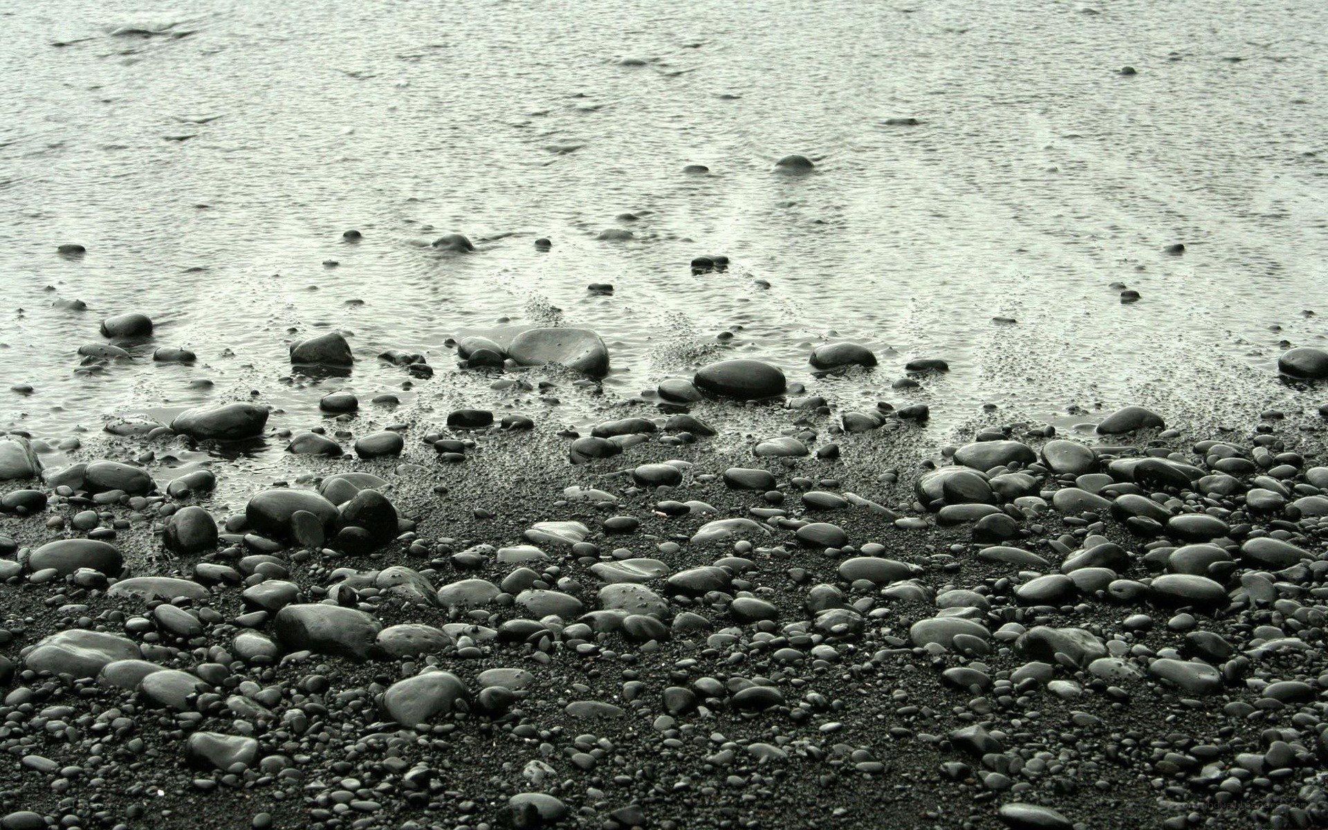Wet pebbles on a beach