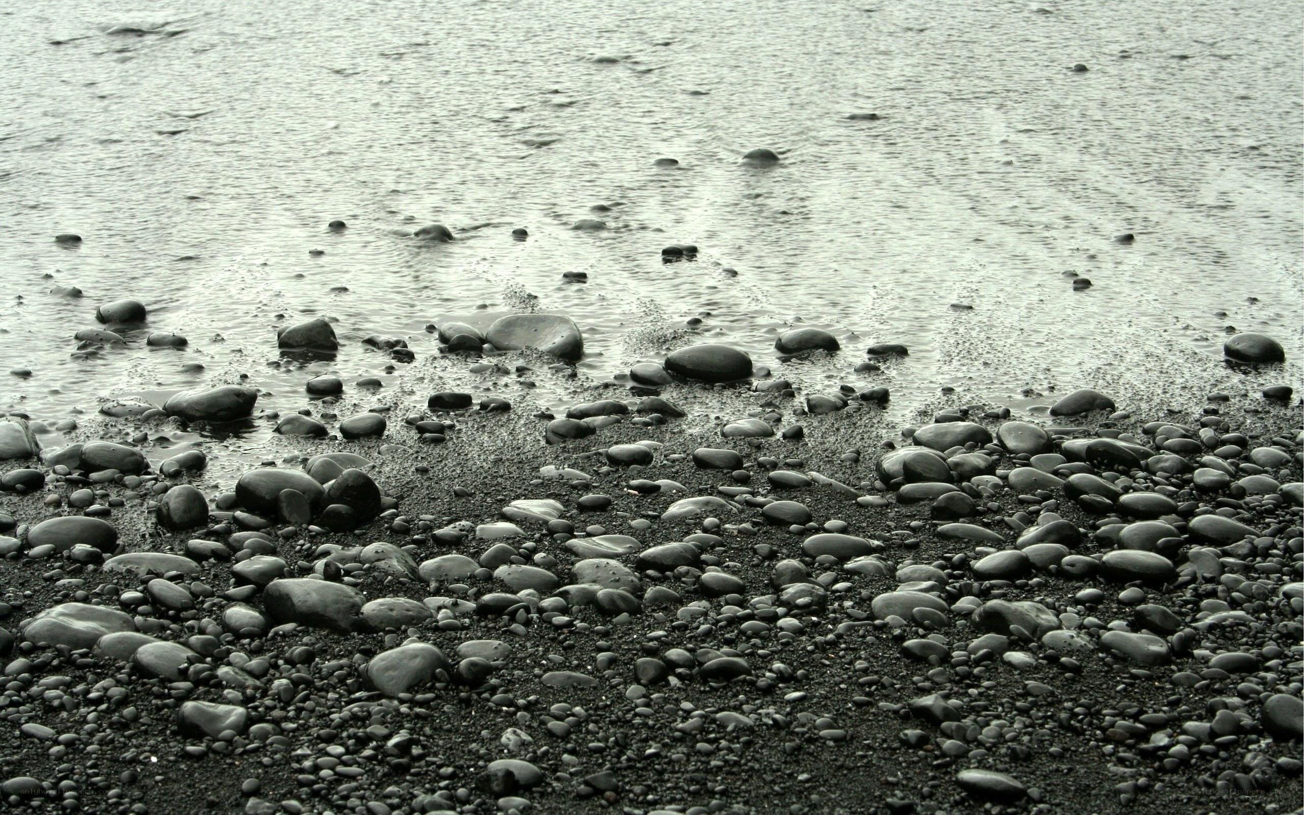 Wet pebbles on a beach