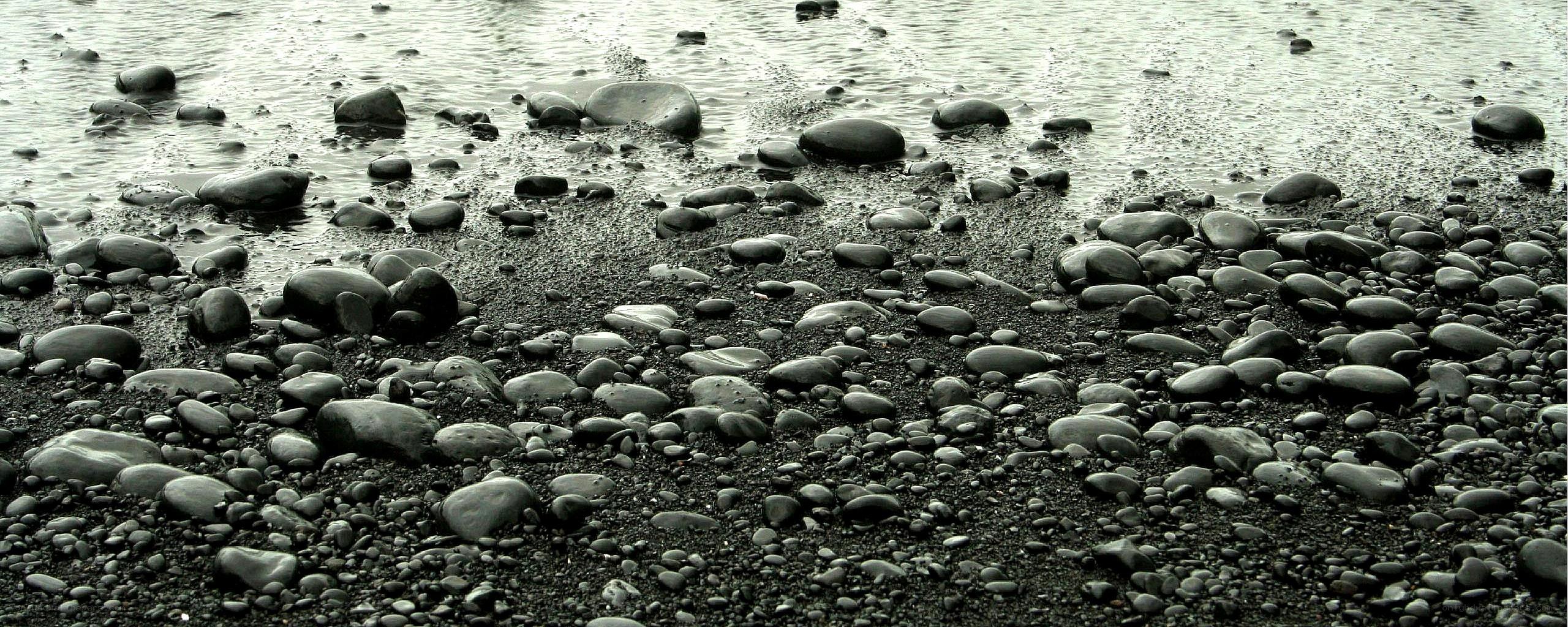 Wet pebbles on a beach