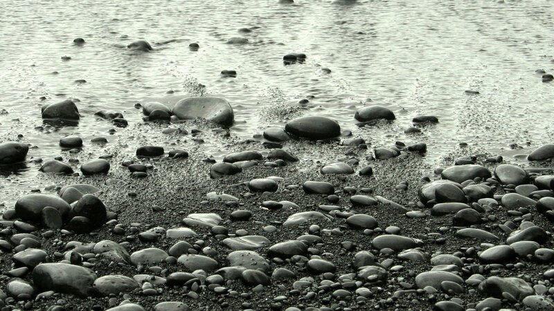 Wet pebbles on a shoreline
