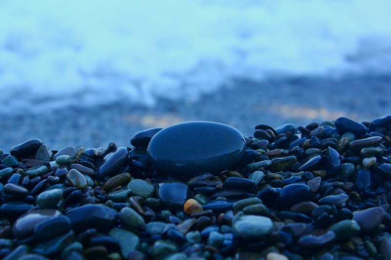 Wet Pebbles on Beach — Blue