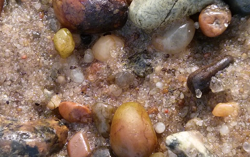 Wet Pebbles on Sand