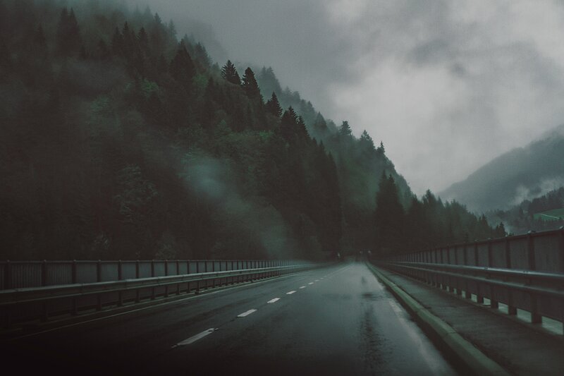 Wet Road in Mountain Forest