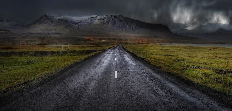 Wet Road in Mountain Landscape