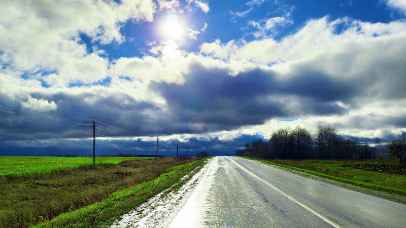 Wet Road under Cloudy Sky — Blue