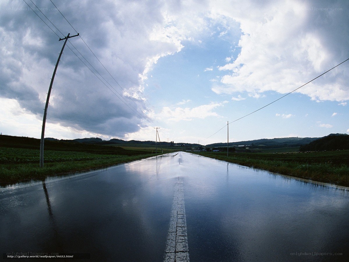Wet Road Under Cloudy Sky