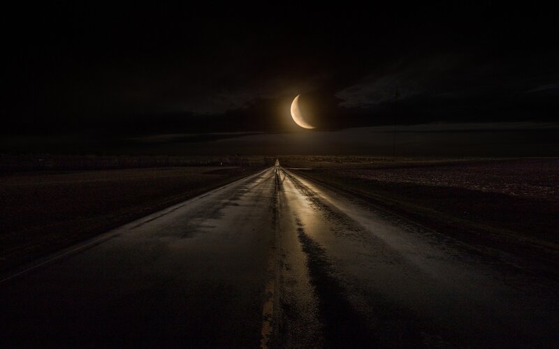 Wet Road under Crescent Moon