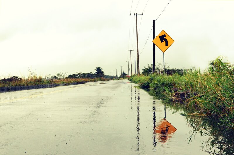 Wet Road with Sign