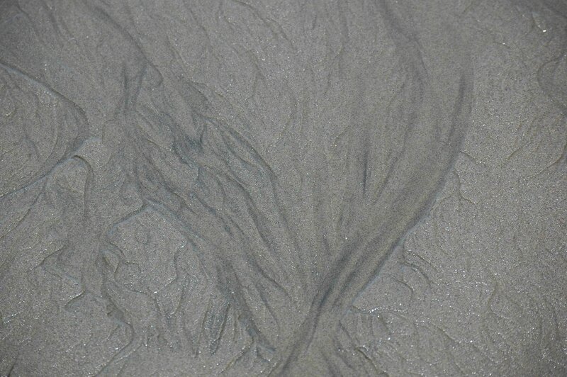 Wet sand patterns on a beach