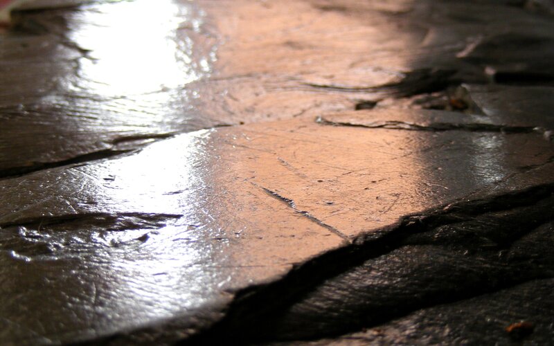 wet stone pavement surface