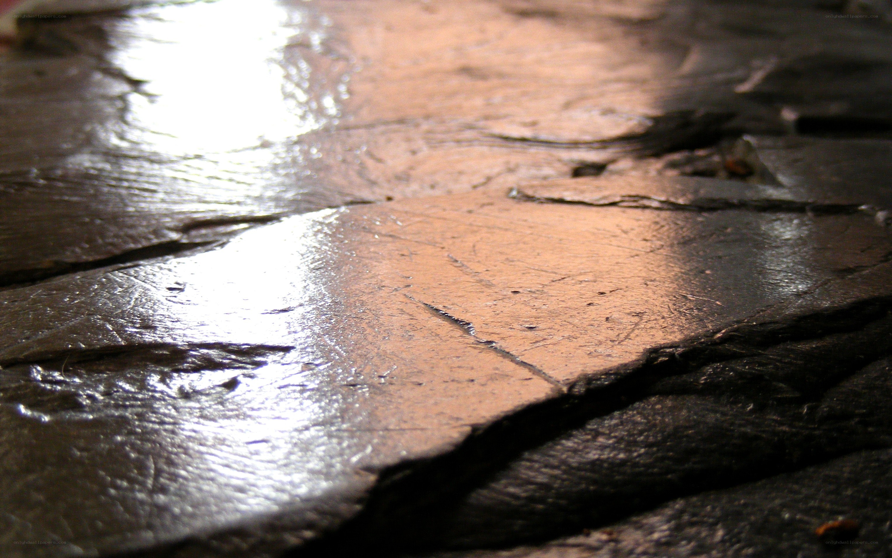 wet stone pavement surface