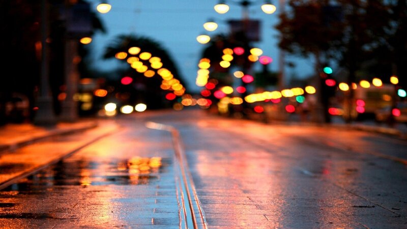 wet street at dusk with lights