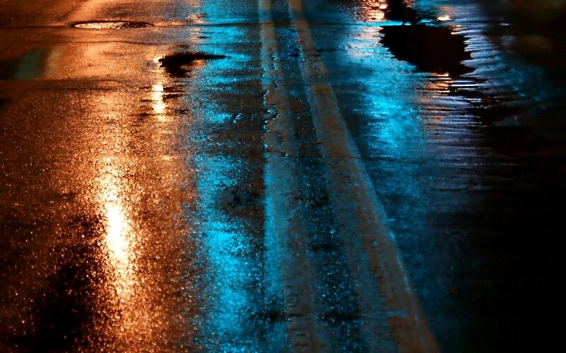wet street at night with lights
